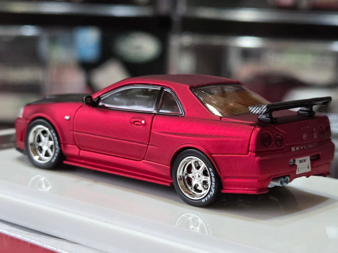 限定700台1/64車魔王AUTOEXPO2025日産スカイラインGT-R34赤
