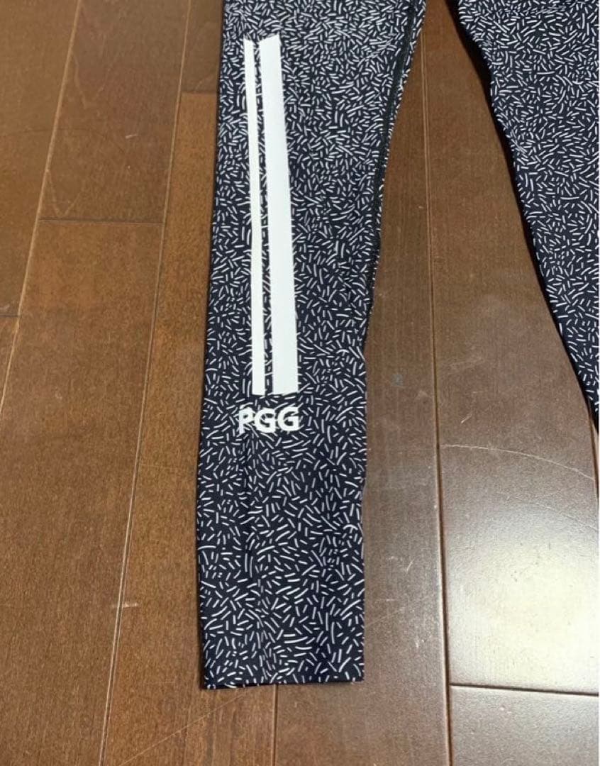 新品パーリーゲイツPGG黒地総柄レギンス女性用